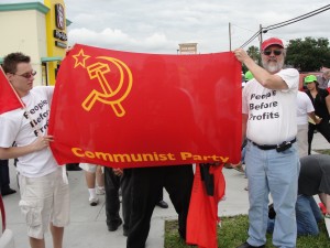 Communists participate in the May day march in Houston, 2012